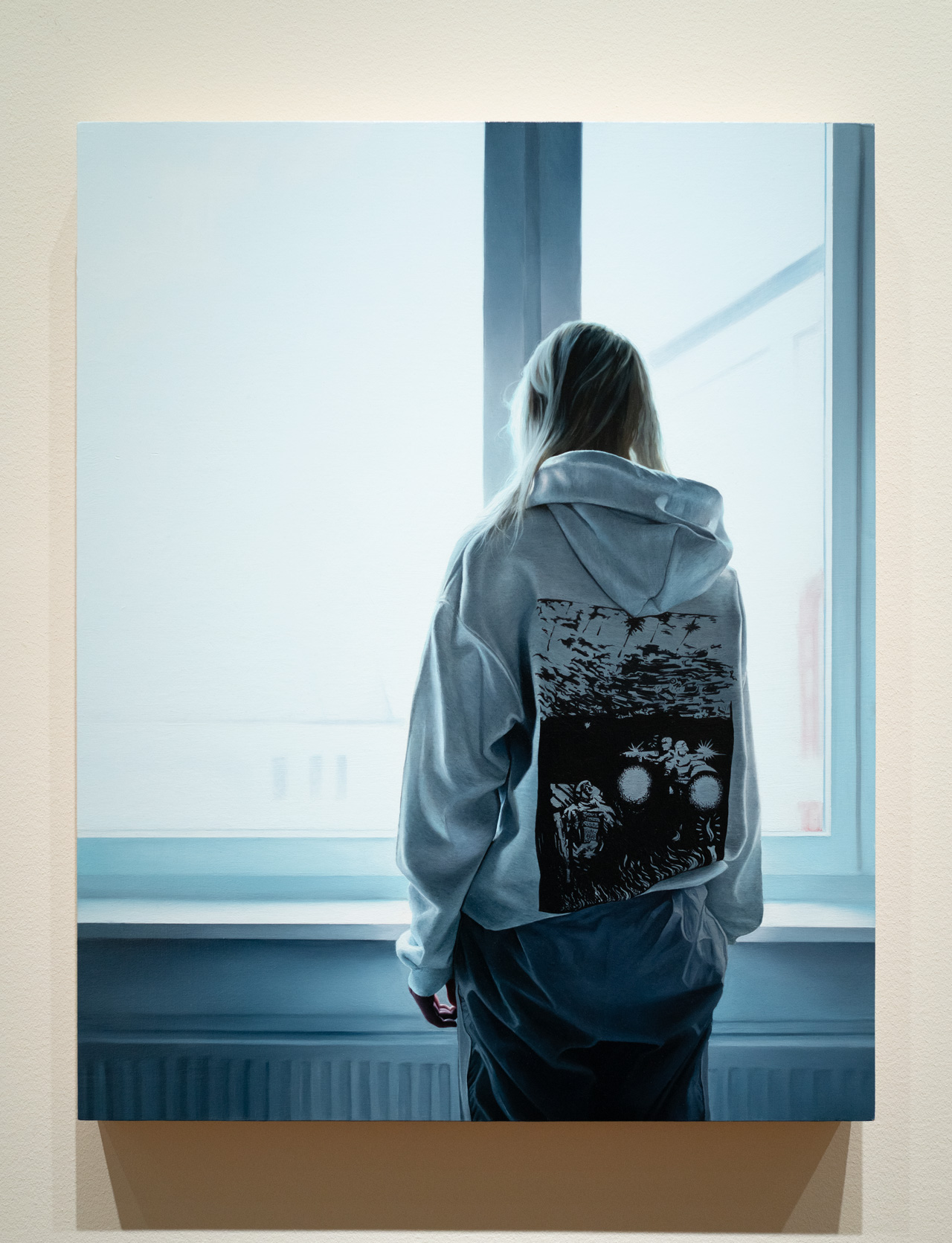 Painting Ukranian girl mounted and framed in the gallery, showing the complete composition of the figure by the window with lateral light filtering through