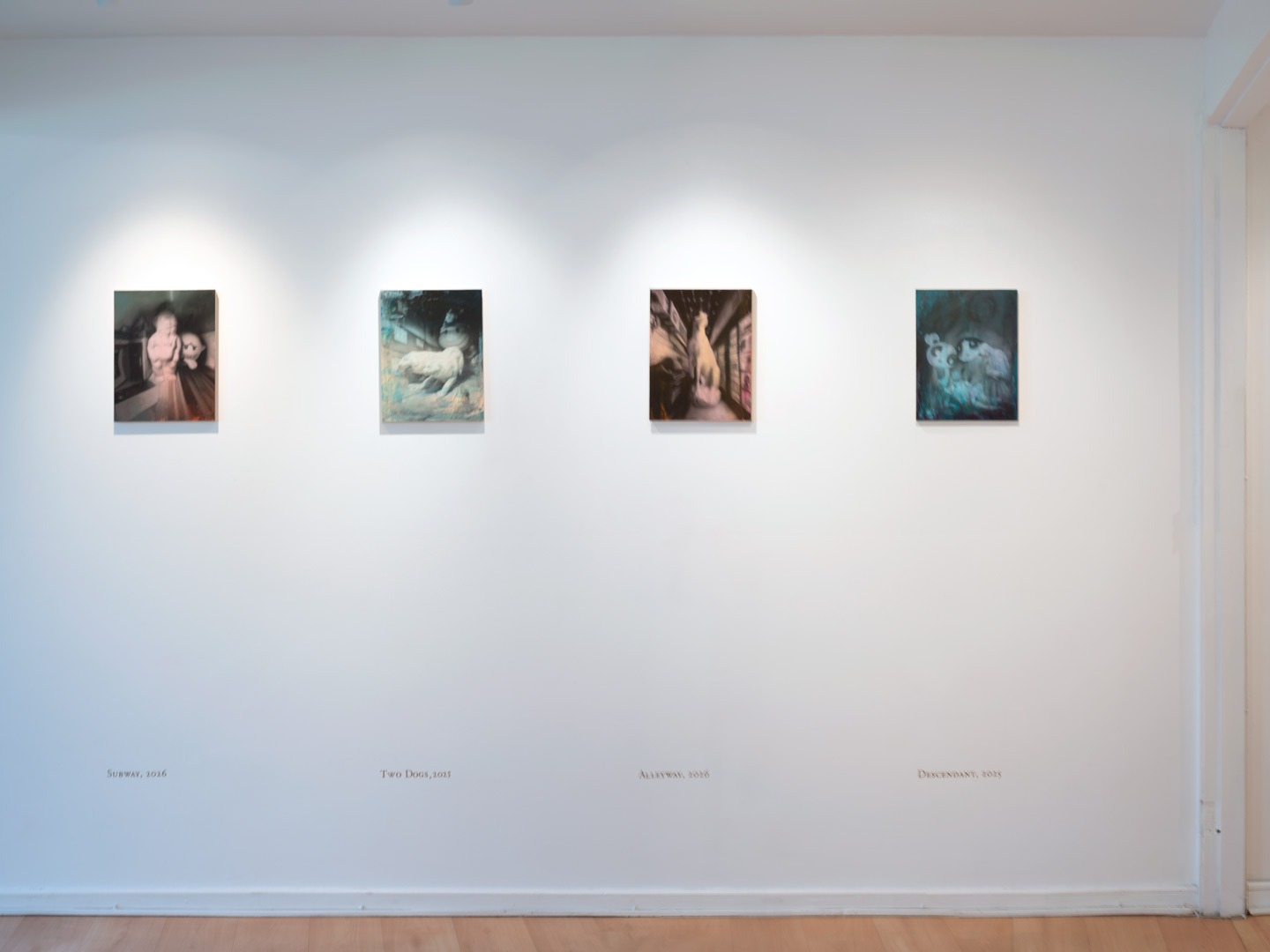 Four oil paintings hung in a row on a white wall: Subway, Two Dogs, Alleyway, and Descendant, each on wooden panel